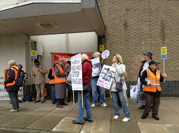 campaigners outside meeting