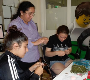 Learning to knit at the recent Hanwell Library open day 