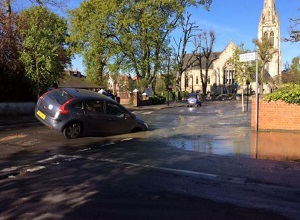 Car In Hole After Water Main Bursts in W13 