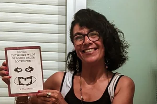 Nayma Chamchoun with her published collection of poems 