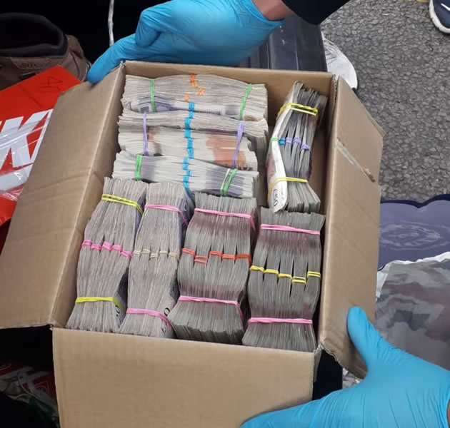 A box of cash seized during the operation 