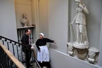 Councillor Julian Bell is shown around Pitzhanger Manor by the maid in costume
