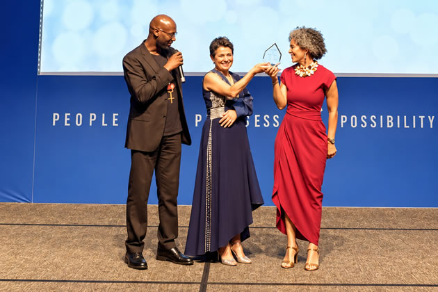 Luxmi receives her award at the gala event in London 