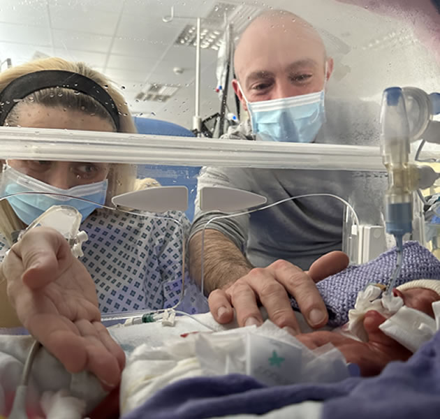 Peter and Lizzy comfort Maddie when she was in the incubator