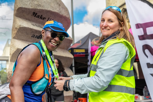 One of the successful athletes receiving her medal from a volunteer 